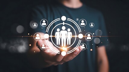 Fototapeta premium Businessman holding digital target icon with human figures representing customer segmentation and market strategy