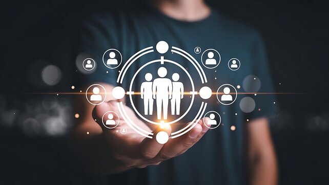 Businessman holding digital target icon with human figures representing customer segmentation and market strategy