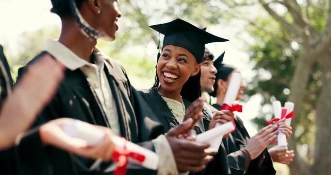 Smile, students and applause at campus at graduation, speech and celebration of degree completion. People, cheering and graduate outdoor with regalia, university recognition and educational milestone