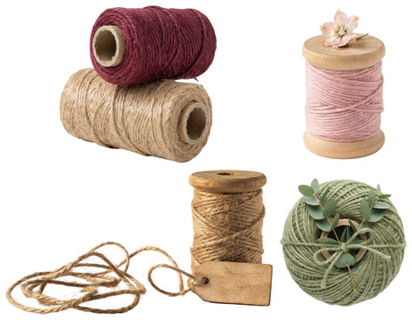 An assortment of colorful rustic jute twine spools with botanical accents and wooden tags for gift wrapping and handcrafts.