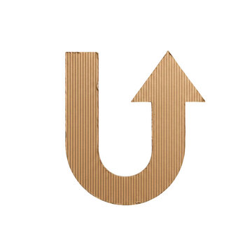 Letter u shaped arrow made of brown corrugated cardboard, directional sign, isolated on a white background, view isolated on a transparent background
