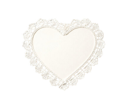 A beautiful heart shaped white crocheted doily with an intricate lace border isolated on a transparent background