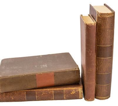 Two antique brown books arranged at an angle isolated on transparent background.