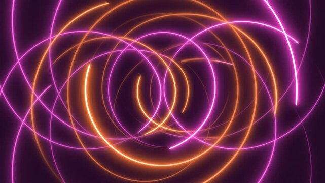 Vibrant neon glowing circles spinning in continuous motion creating hypnotic abstract background light animation video clip