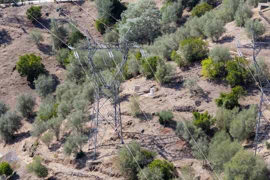Electricity transmission lines crossing hillside near castelo de bode dam
