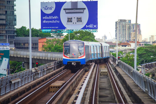 Bangkok, Thailand - June  16, 2026 : A BTS Skytrain pulling into Saphan Taksin Station in the afternoon.