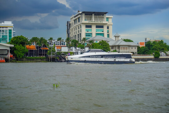 Bangkok, Thailand - June  16, 2026 : Electric passenger boats operating on the Chao Phraya River during the daytime.