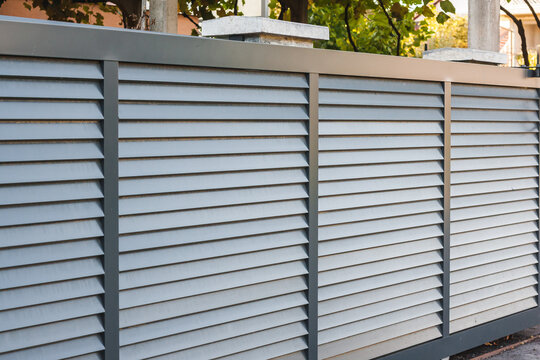 Modern fence with aluminum or metal shutter
