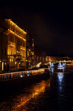 Christmas city lights illuminate a historic canal