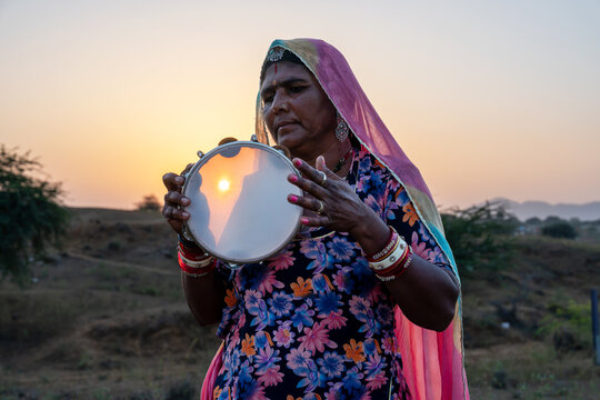 Rajasthani folklore musician with Khanjari Dafli instrument in Pushkar Rajasthan India