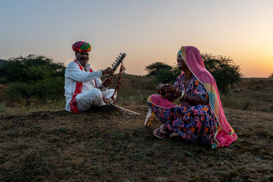 Rajasthani folklore musician and singer with ravanahatha and Khanjari Dafli instrument in Pushkar Rajasthan India