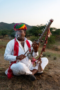 Rajasthani folklore musician playing  Ravanahatha instrument in Pushkar Rajasthan India