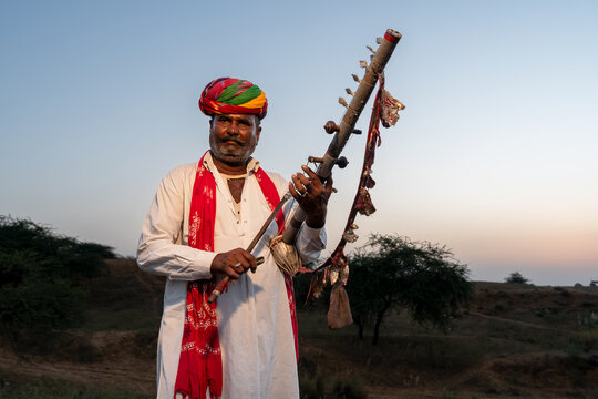 Rajasthani folklore musician playing  Ravanahatha instrument in Pushkar Rajasthan India