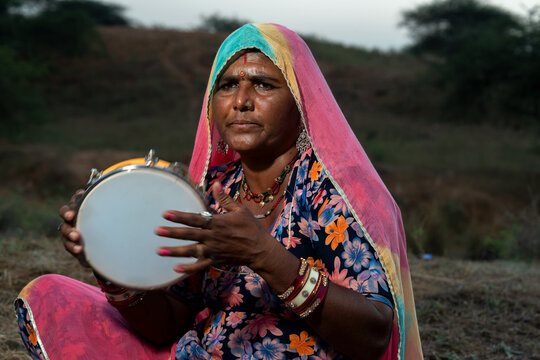 Rajasthani folklore musician with Khanjari Dafli instrument in Pushkar Rajasthan India