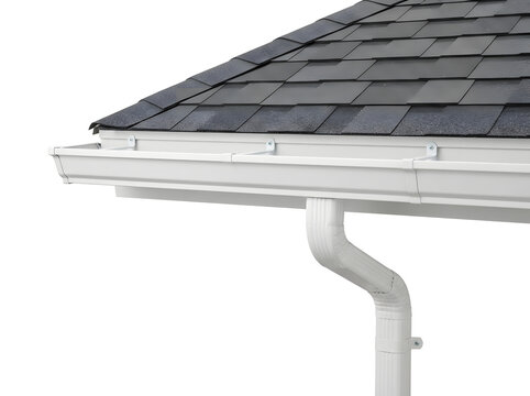 White vinyl gutter system attached to dark shingle roof with seamless downspout connection
