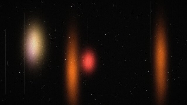 Orange and red film light leak glow with grain and dust on black