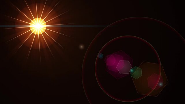 Golden sun lens flare animation with glowing colorful hexagonal light artifacts on dark background