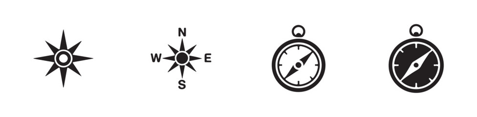 Variety of compasses and wind rose symbols, including cardinal directions for exploration and travel themes. © Joynab