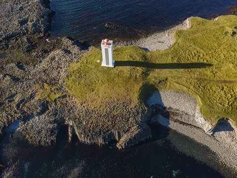 Lighthouse and coastal landscape with basalt formations, K&aacute;lfshamarsv&iacute;k, Skagi Peninsula, Iceland