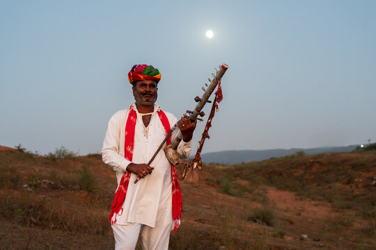 Rajasthani folklore musician playing  Ravanahatha instrument in Pushkar Rajasthan India