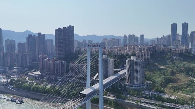 Aerial view of Nanjimen Bridge with monorail and city skyline in Chongqing, China in Nanjimen Bridge, Chongqing, China