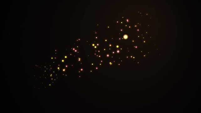 Golden glitter particles floating in graceful wave motion over dark elegant black background.