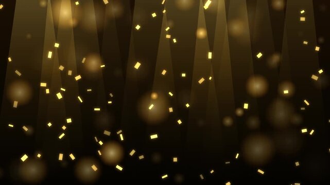 Golden confetti falling with spotlight beams on black background for festive party celebration.