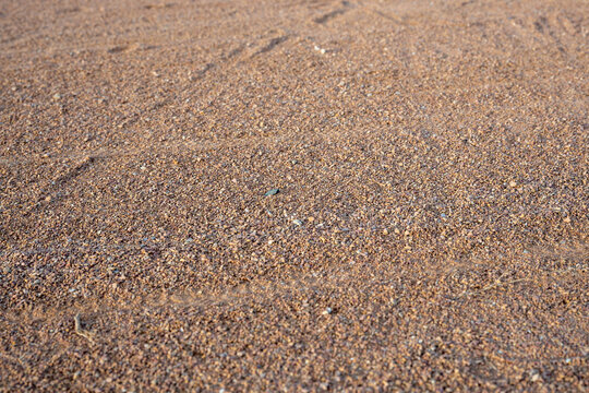 Abstract Overhead Textured Background of a Red Dirt Baseball Infield. Clay Sand Silt Background with Copy Space