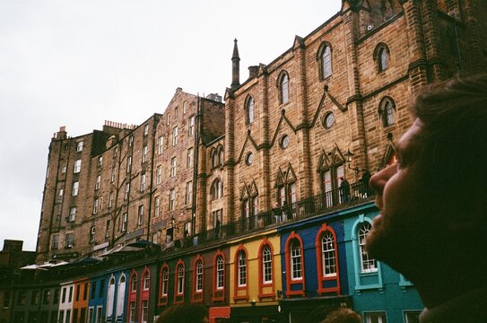 Man Looking  up at Buildings at the Royal Mile in Edinburgh