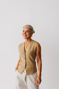 Smiling senior woman showing confident elegant style