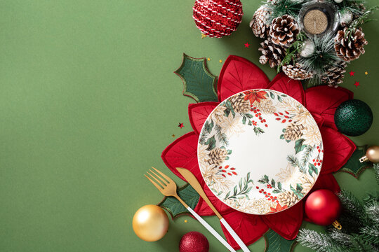 Christmas table setting with plate and holiday decoration