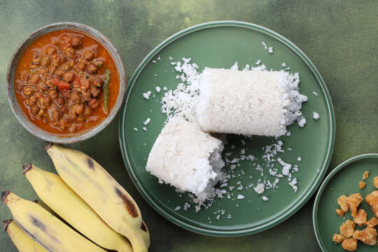 Puttu is a traditional Kerala breakfast made with steamed rice flour and freshly grated coconut, layered and cooked until soft and fluffy.
served with flavorful kadala curry, banana, ghee