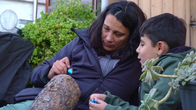 family decorating a tio de nadal log during Catalonian tradition