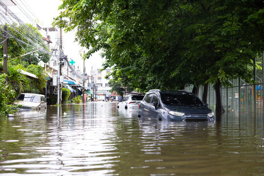 Cars submerged in water. Street after heavy rain. Disaster Motor Vehicle Insurance Claim, Severe weather