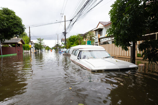 Cars submerged in water. Street after heavy rain. Disaster Motor Vehicle Insurance Claim, Severe weather