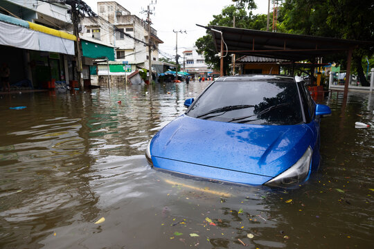 Cars submerged in water. Street after heavy rain. Disaster Motor Vehicle Insurance Claim, Severe weather