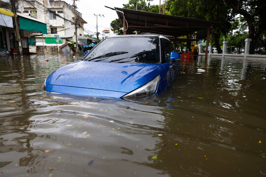 Cars submerged in water. Street after heavy rain. Disaster Motor Vehicle Insurance Claim, Severe weather
