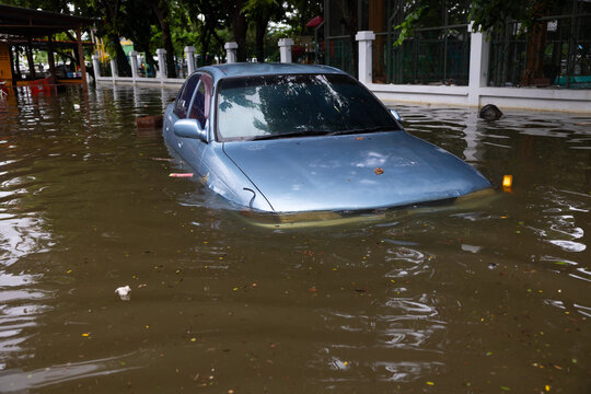 Cars submerged in water. Street after heavy rain. Disaster Motor Vehicle Insurance Claim, Severe weather