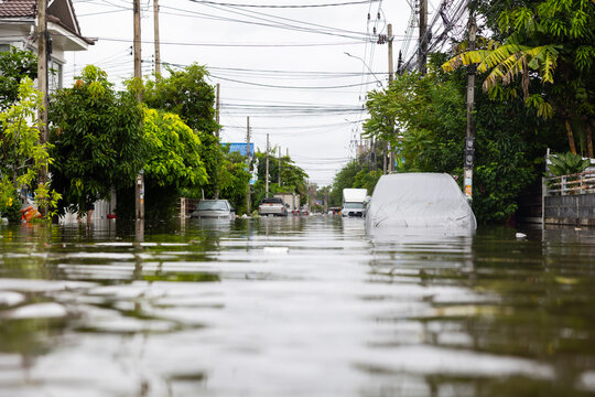 Cars submerged in water. Street after heavy rain. Disaster Motor Vehicle Insurance Claim, Severe weather