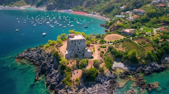 San Nicola Arcella Calabria Italy 4k cinematic drone view of Torre Crawford Saracen tower . Square stone watchtower on rocky cliff promontory over turquoise Tyrrhenian sea b-roll establishing footage
