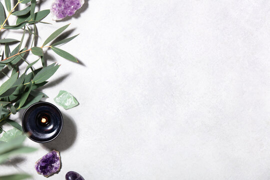Wellness Background with Eucalyptus, Crystals and Burning Candle