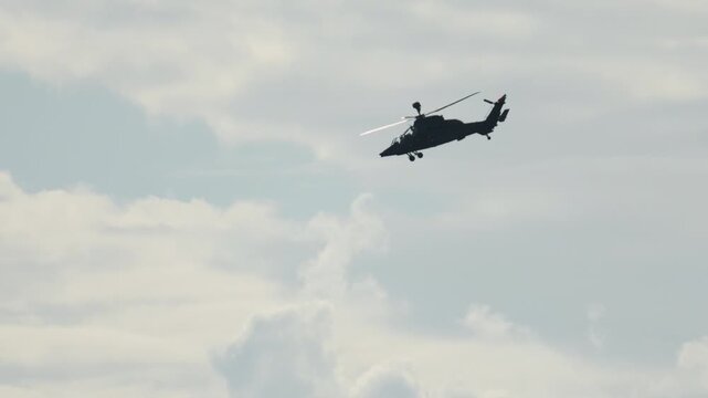 Military attack helicopter Eurocopter Tiger flying in the sky