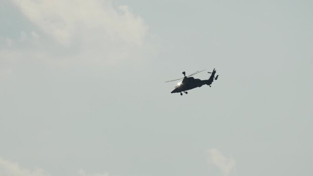 Military attack helicopter Eurocopter Tiger flying in the sky