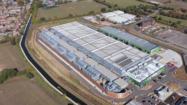 Aerial view of the Google Data Centre facility in Waltham Cross, featuring large industrial rooftops and surrounding infrastructure in Cheshunt, England, United Kingdom.