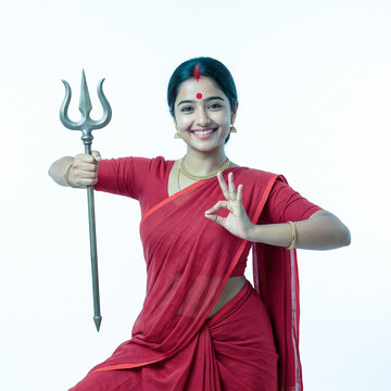 Young Bengali Woman in Red Saree Holding Trishul Trident as Goddess Durga