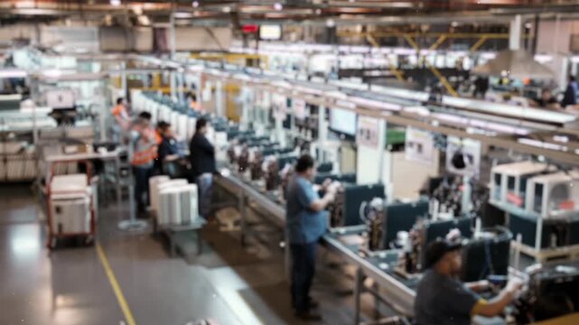 Blurred View of Factory Assembly Line with Workers Assembling Appliances - 4K