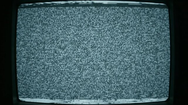 Old CRT television screen showing white noise static interference and signal loss