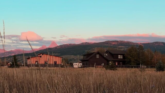 Farm house with grand teton in background 