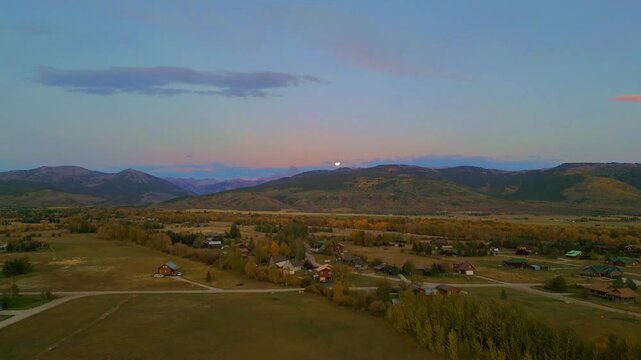 Full moon over farm land in Driggs Idaho teton valley 