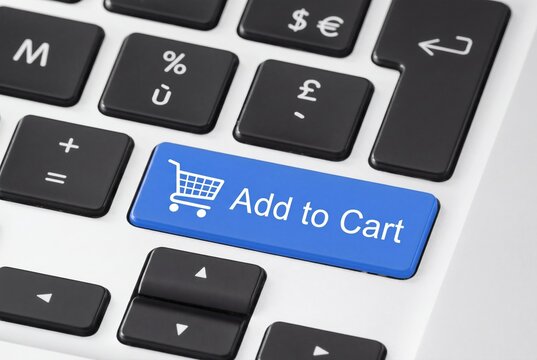 E-commerce shopping cart button on laptop keyboard, blue add to cart key for online retail, digital consumerism and business.